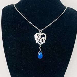 Stainless steel I LOVE YOU heart pendant & a 20.” Long matching necklace